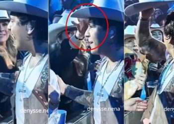 Christian Nodal regaña a fan que le quiso robar el sombrero.